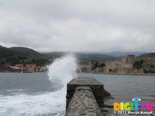 SX27416 Wave splashing against harbour wall in Collioure